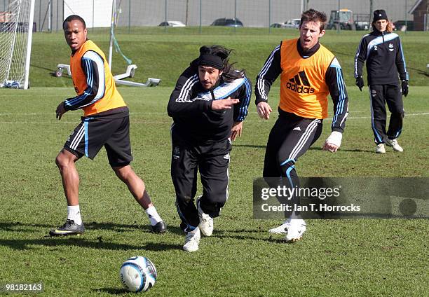 Jonas Gutierrez escapes the attentions of Fabrice Pancrate and Mike Williamson during a Newcastle United training session at the Little Benton...