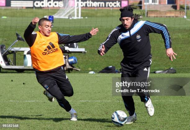Jonas Gutierrez and Danny Simpson during a Newcastle United training session at the Little Benton training ground on April 01, 2010 in Newcastle,...