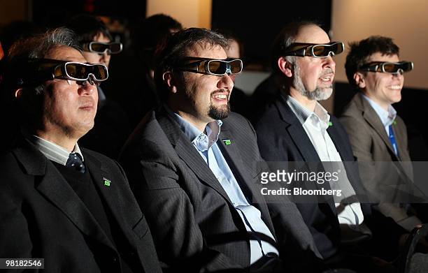 Panasonic U.K. Employees wearing 3-D TV glasses watch a movie on a 3D capable 'Viera' television set by Panasonic Corp. In London, U.K., on...