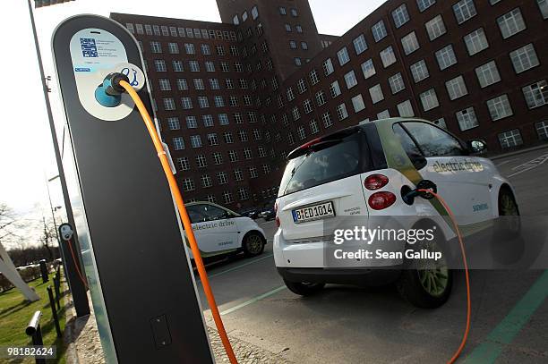 Company electric Smart car of German engineering company Siemens, at the behest of the photographer, stands attached via a charging cable from a...