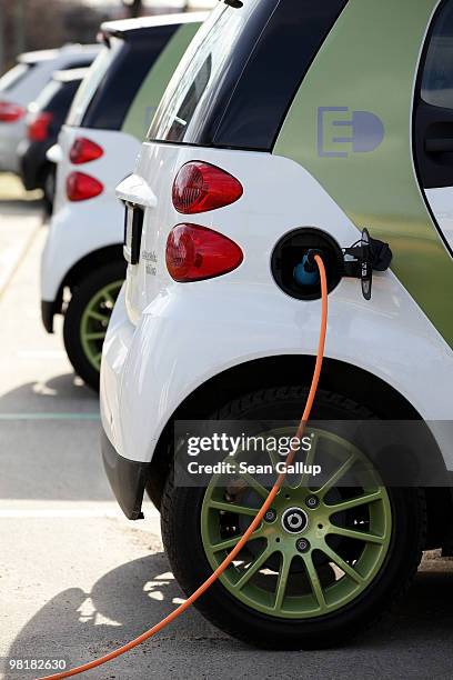Company electric Smart car of German engineering company Siemens, at the behest of the photographer, stands attached via a charging cable from a...