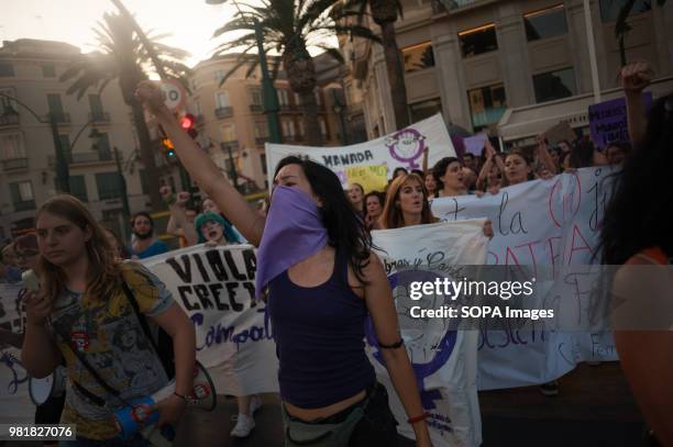 Woman cover her face with a violet kerchief as she takes part in the protest. A demonstration against the last judicial resolution from the...
