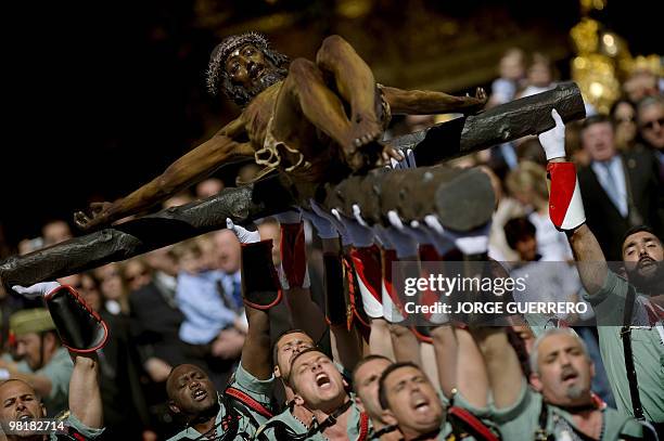 Members of the Spanish Legion carry the icon, Christ of the Good Death to the Santo Domingo de Guzman Church during an easter procession on April 1,...