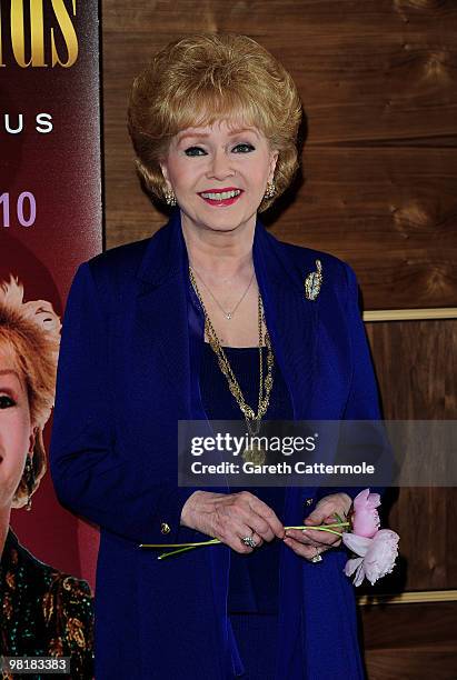 Debbie Reynolds poses during a photocall to promote her UK tour 'Alive and Fabulous' on her 78th birthday at The Sofitel Hotel, St James on April 1,...