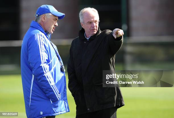 Chelsea manager Carlo Ancelotti talks to Ivory Coast manager Sven-Göran Eriksson during a training session at the Cobham Training Ground on April 1,...