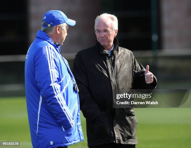 Chelsea manager Carlo Ancelotti talks to Ivory Coast manager Sven-Göran Eriksson during a training session at the Cobham Training Ground on April 1,...
