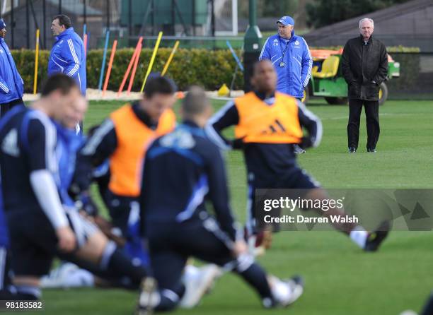Chelsea manager Carlo Ancelotti talks to Ivory Coast manager Sven-Göran Eriksson as they watch Didier Drogba during a training session at the Cobham...