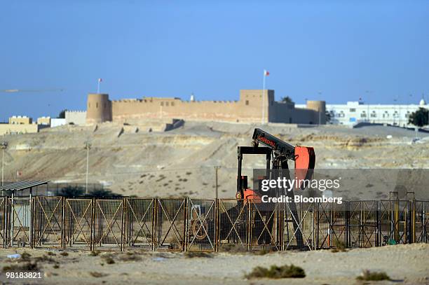 An oil pump operates near Riffa fort at the Bahrain Petroleum Company run oil field in Awali, Bahrain, on Tuesday, March 30, 2010. Bahrain's low...