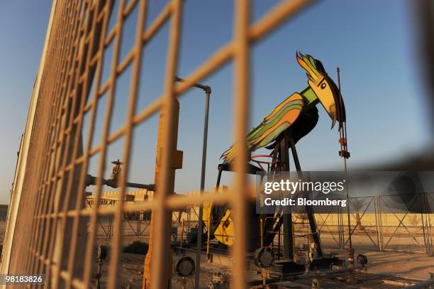 An oil pump operates at the Bahrain Petroleum Company run oil field in Awali, Bahrain, on Tuesday, March 30, 2010. Bahrain's low levels of debt give...