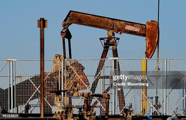 An oil pump operates at the Bahrain Petroleum Company run oil field in Awali, Bahrain, on Tuesday, March 30, 2010. Bahrain's low levels of debt give...