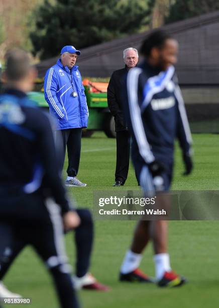 Chelsea manager Carlo Ancelotti talks to Ivory Coast manager Sven-Göran Eriksson as they watch Didier Drogba during a training session at the Cobham...