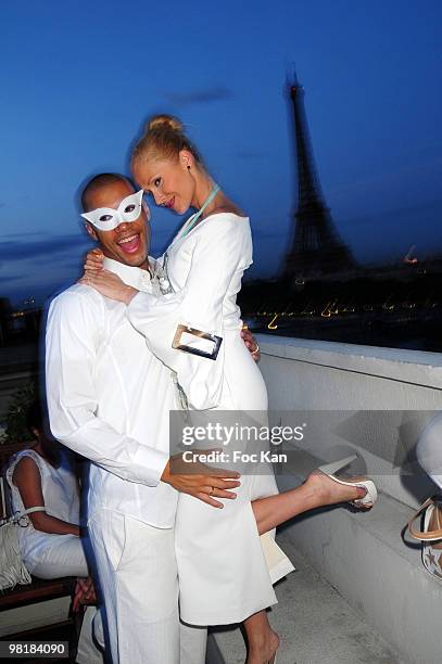 Personalities Xavier Delarue, his wife Tatiana Laurens Delarue from Secret Story attend the 14th July White Party at Pierre Guillermo's Quai Kennedy...