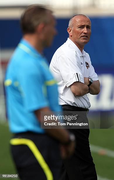 Head coach Dominic Kinnear the Houston Dynamo talks with the referee during a MLS game against FC Dallas at Pizza Hut Park on March 27, 2010 in...