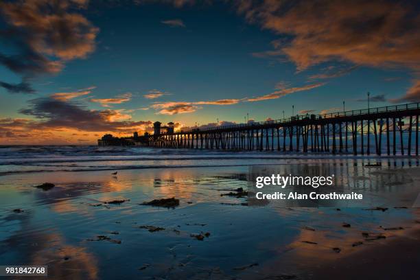 clouds and reflections in oceanside - oceanside pier stock pictures, royalty-free photos & images