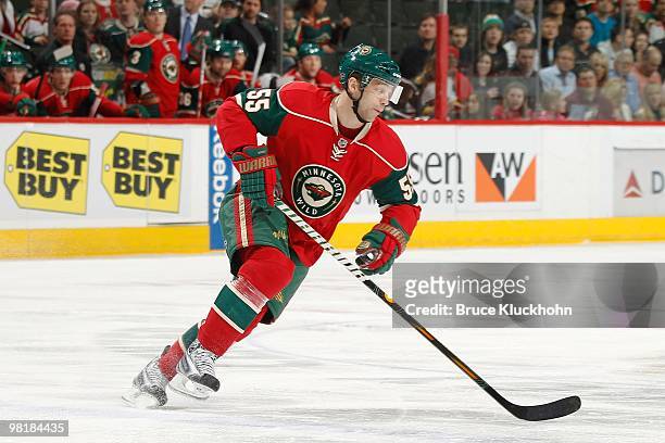 Nick Schultz of the Minnesota Wild skates with the puck against the San Jose Sharks during the game at the Xcel Energy Center on March 23, 2010 in...