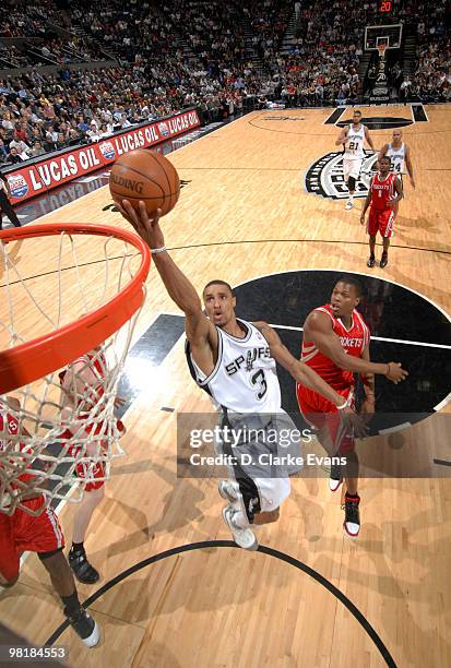 George Hill of the San Antonio Spurs shoots a layup against the Houston Rockets on March 31, 2010 at the AT&T Center in San Antonio, Texas. NOTE TO...