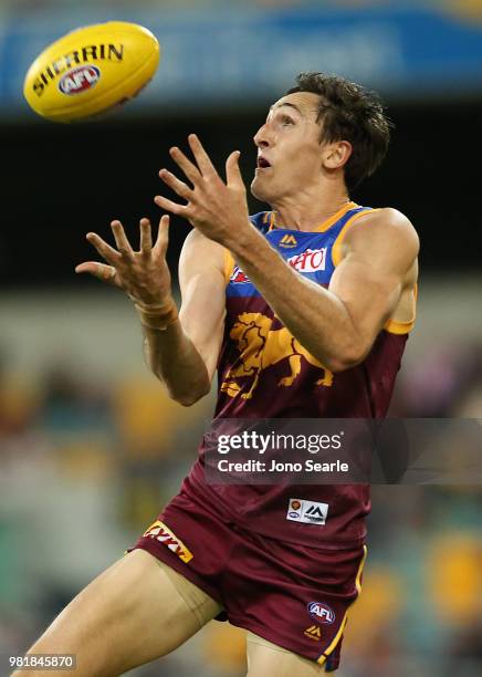 Oscar McInerney of the Lions makes a mark during the round 14 AFL match between the Brisbane Lions and the Greater Western Sydney Giants at The Gabba...