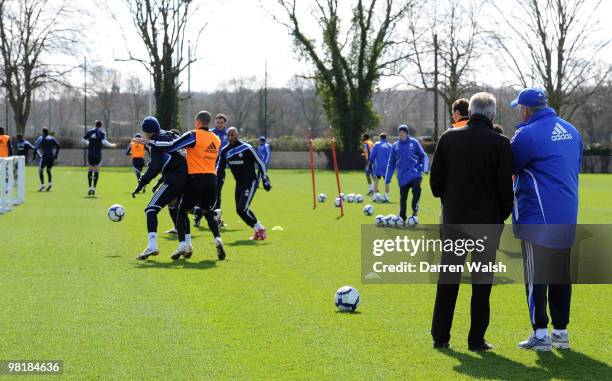 Chelsea manager Carlo Ancelotti talks to Ivory Coast manager Sven-Göran Eriksson as they watch during a training session at the Cobham Training...