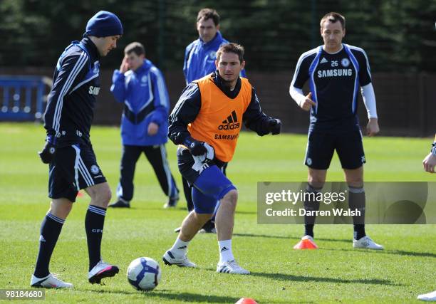 Frank Lampard and Yury Zhirkov of Chelsea during a training session at the Cobham Training Ground on April 1, 2010 in Cobham, England.