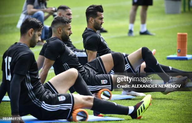 Iran's players do ground exercice during a training session in Bakovka outside Moscow on June 23 ahead of the 2018 World Cup Group B Football match...