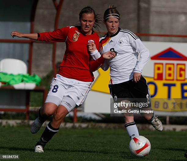 Marie-Louise Begahorn of Germany competes with Kristine Hegland Wigdahl of Norway during the U19 women international friendly match between Norway...