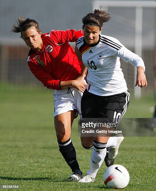 Dzsenifer Marozsan of Germany competes with Cathrine Dekkerhus of Norway during the U19 Women International Friedly between Norway and Germany at the...