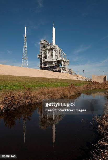 the ares i-x rocket is seen on the launch pad at kennedy space center. - launch pad stock pictures, royalty-free photos & images