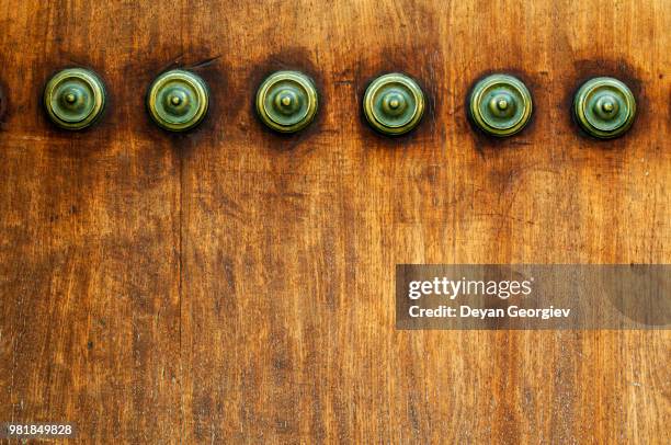 ornaments on a wooden door - hardwood tree stock pictures, royalty-free photos & images