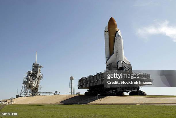 space shuttle endeavour approaches the launch pad at kennedy space center. - spaceport stock pictures, royalty-free photos & images