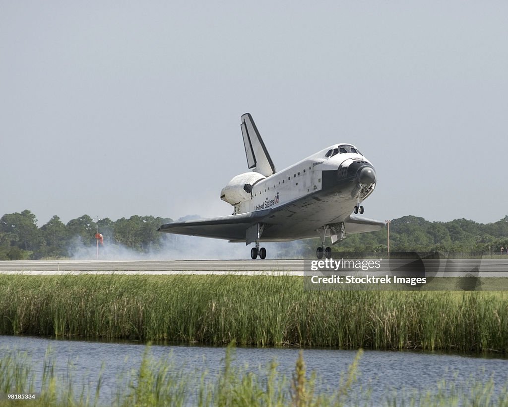 Space Shuttle Endeavour touches down on the runway at Kennedy Space Center.