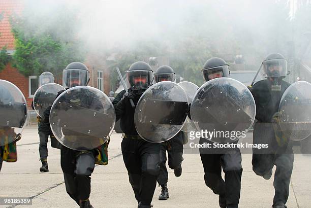 belgian infantry soldiers training in crowd and riot control. - riot shield stock pictures, royalty-free photos & images