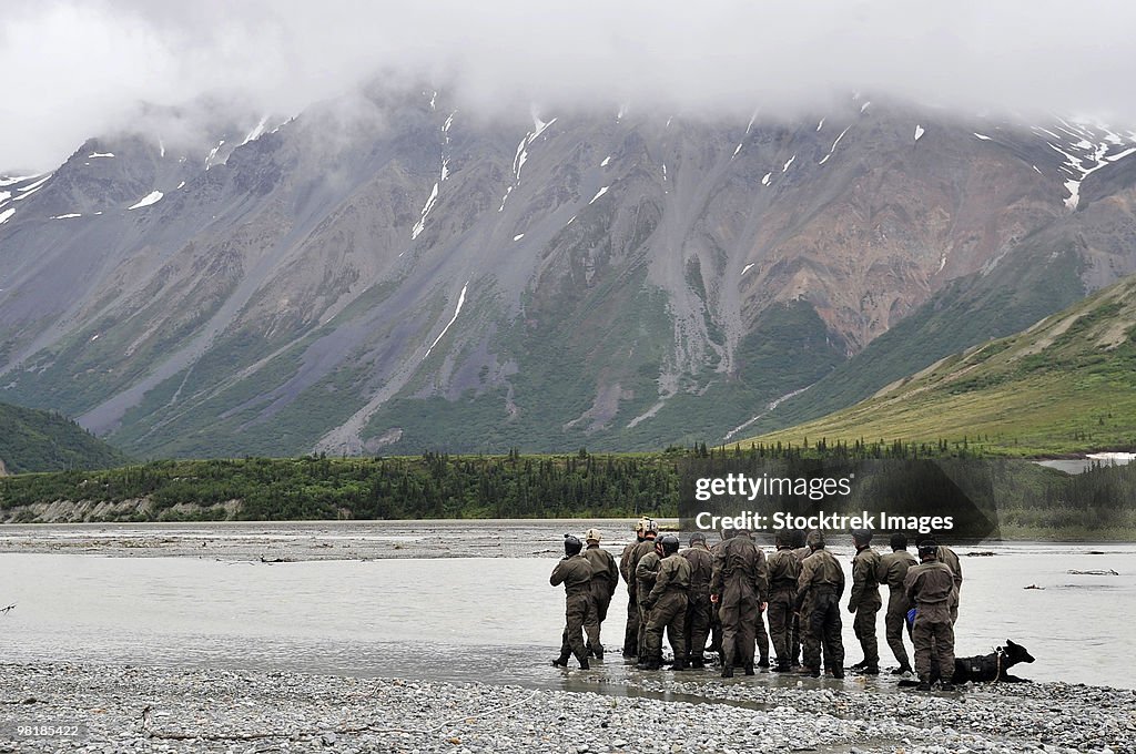 A group of Navy SEAL's prepares to cross Phelan Creek.