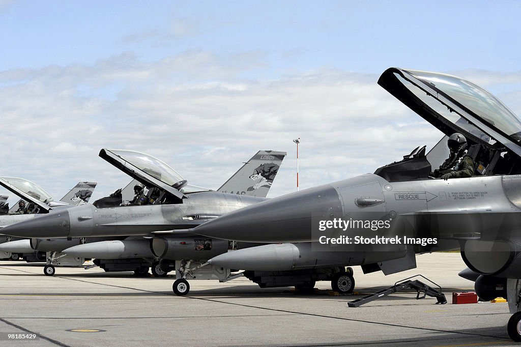 F-16 Fighting Falcons await to launch for a training mission.