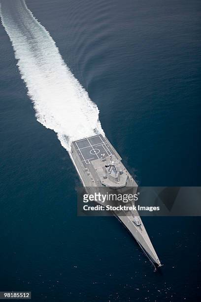 aerial view of the littoral combat ship independence underway during builder's trials in the gulf of - littoral stock pictures, royalty-free photos & images