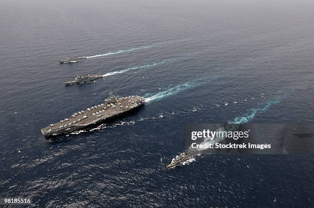 a formation of ships traveling at sea. - cruzador navio de guerra - fotografias e filmes do acervo