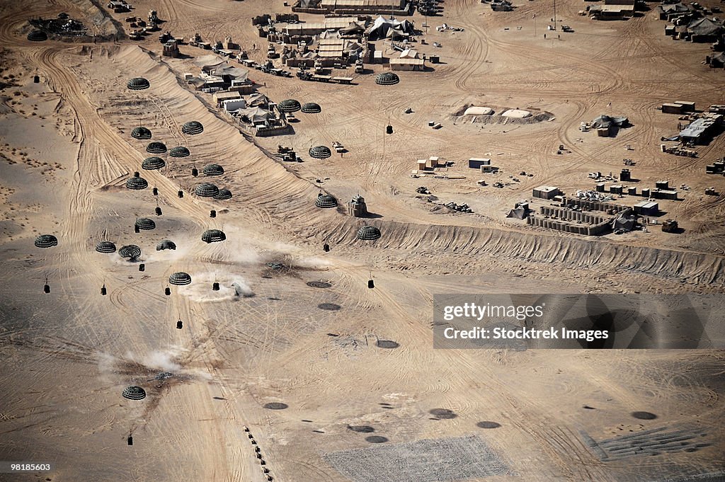Container delivery system bundles dropping from a C-17 Globemaster III in Afghanistan.
