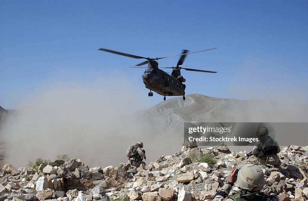 Clouds of dust kicked up by the rotor wash of a CH-47 Chinook helicopter in Afghanistan.