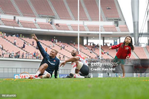 Michael Leitch and Amanaki Lelei Mafi of Japan sit on the pitch after their 28-0 victory in the rugby international match between Japan and Georgia...