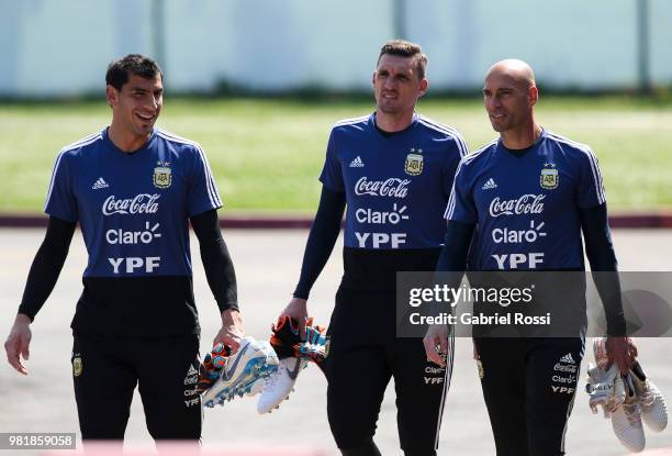 Nahuel Guzman, Franco Armani and Wilfredo Caballero of Argentina arraive prior a training session at Stadium of Syroyezhkin sports school on June 23,...