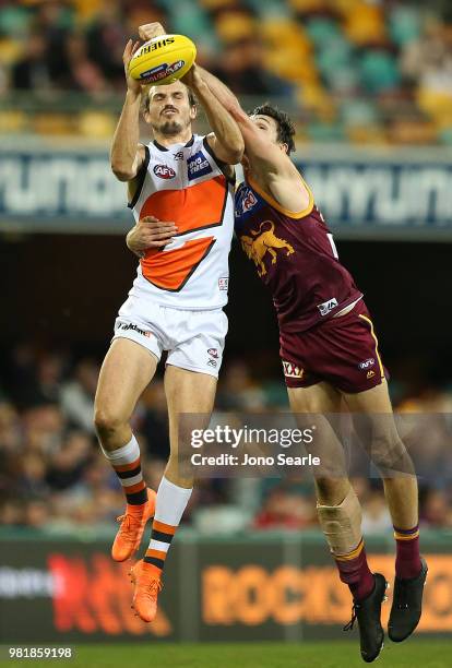 Phil Davis of the Giants marks the ball during the round 14 AFL match between the Brisbane Lions and the Greater Western Sydney Giants at The Gabba...