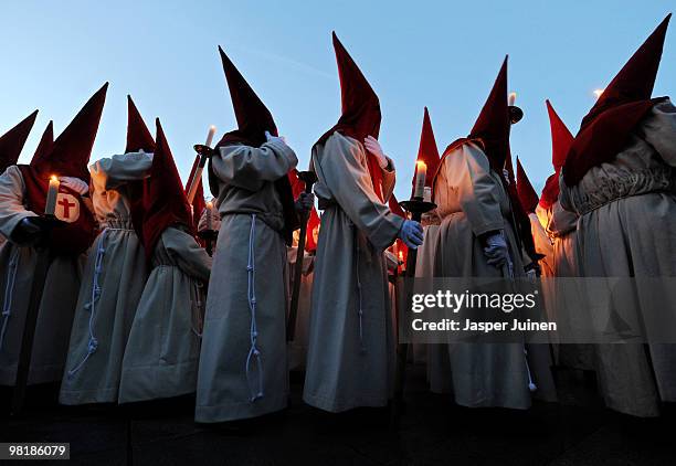 Penitents of the Cofradia del Silencio hold their candles as they walk the streets during a Holy Week procession on March 31, 2010 in Zamora, Spain....