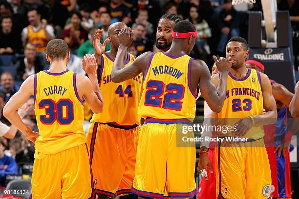 Stephen Curry, Anthony Tolliver, Ronny Turiaf, Anthony Morrow and C.J. Watson of the Golden State Warriors gather on the court during the game...