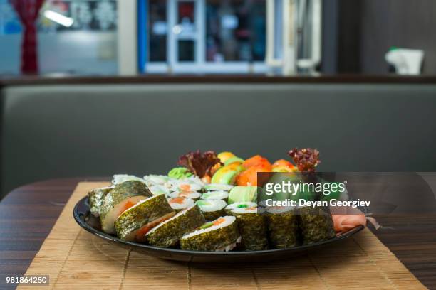 sushi in restaurant - yams day fotografías e imágenes de stock