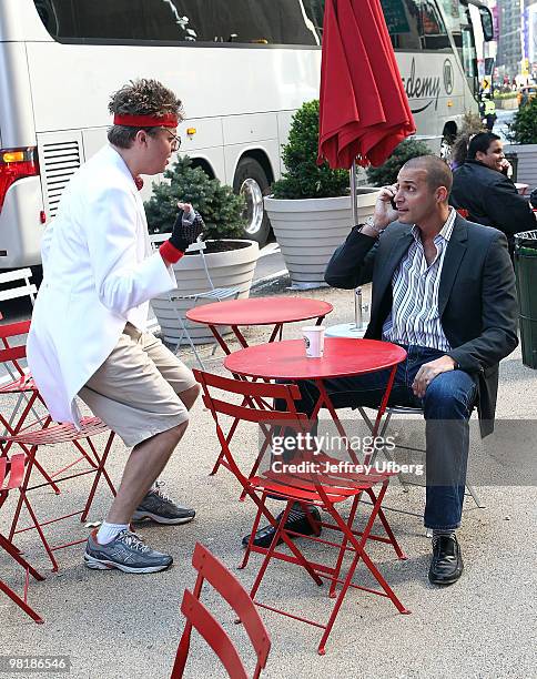 American Idol Contestant "Norman Gentle" aka Nick Mitchell and Nigel Barker shoot the "Brit Slap" music video>> in Times Square on April 1, 2010 in...
