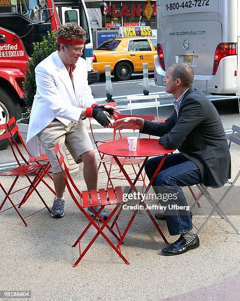 American Idol Contestant "Norman Gentle" aka Nick Mitchell and Nigel Barker shoot the "Brit Slap" music video>> in Times Square on April 1, 2010 in...