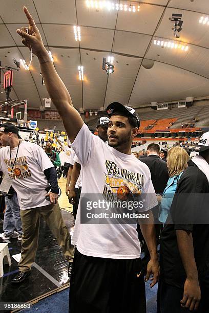 Casey Mitchell of the West Virginia Mountaineers celebrates as he walks off the court after West Virginia's 73-66 win against the Kentucky Wildcats...