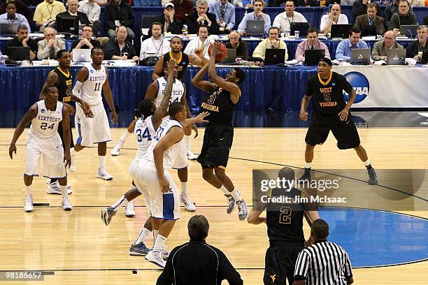 Devin Ebanks of the West Virginia Mountaineers attempts a shot against the Kentucky Wildcats during the east regional final of the 2010 NCAA men's...