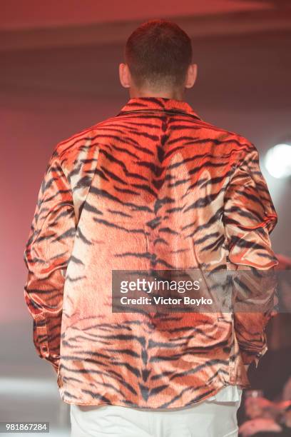 Model walks the runway during the WWWW SSS World Corp Menswear Spring/Summer 2019 show as part of Paris Fashion Week on June 22, 2018 in Paris,...