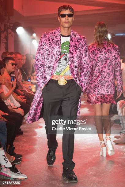 Model walks the runway during the WWWW SSS World Corp Menswear Spring/Summer 2019 show as part of Paris Fashion Week on June 22, 2018 in Paris,...