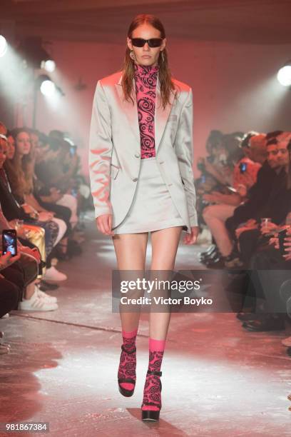 Model walks the runway during the WWWW SSS World Corp Menswear Spring/Summer 2019 show as part of Paris Fashion Week on June 22, 2018 in Paris,...